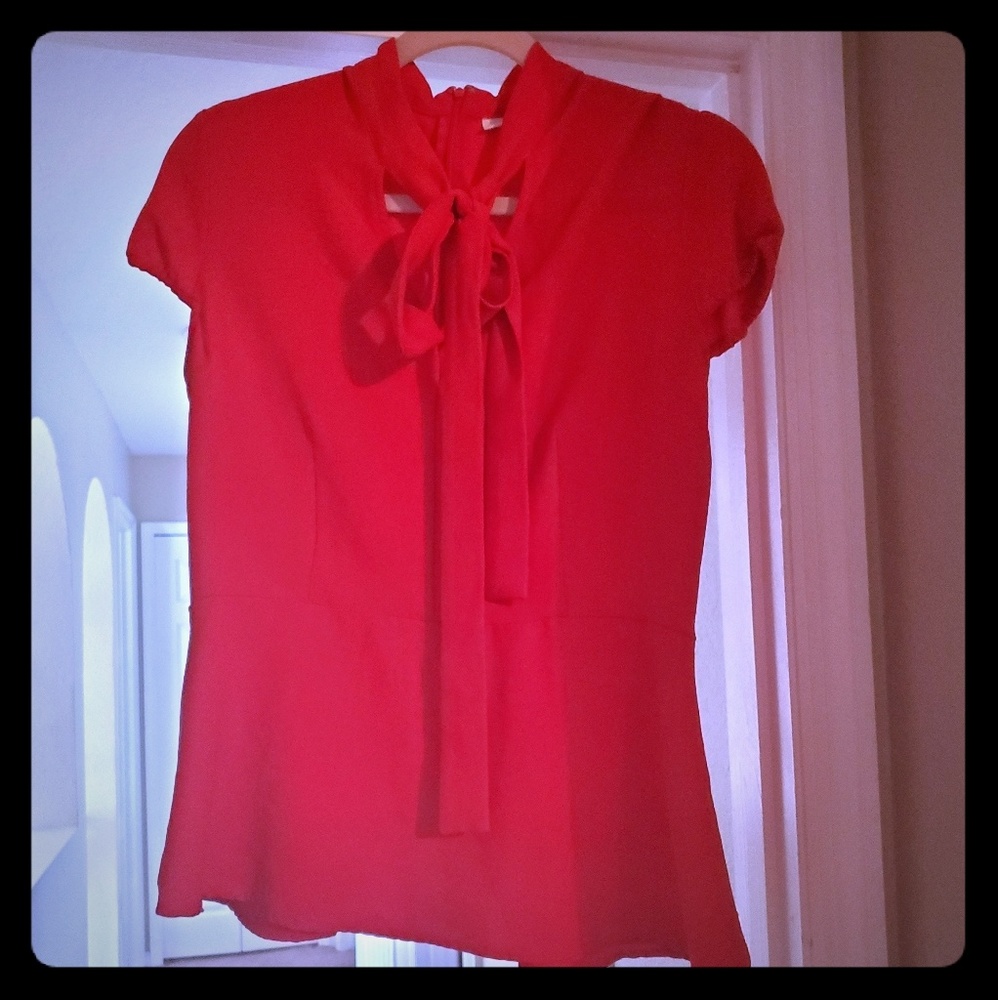 Red Eva Mendes peplum top New York and Company